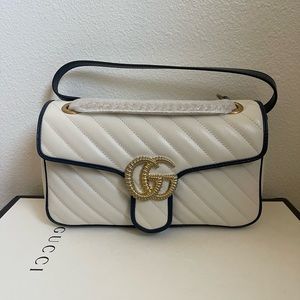 Gucci Handbag, it’s white and never been used.